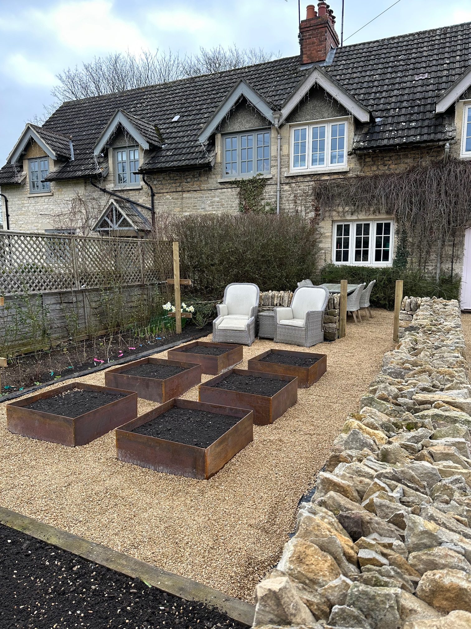 Cotswolds large planters on gravel
